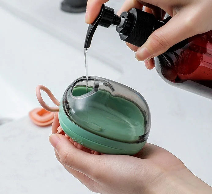 2-in-1 pet cleaning and massage brush with shampoo dispenser in green and blue