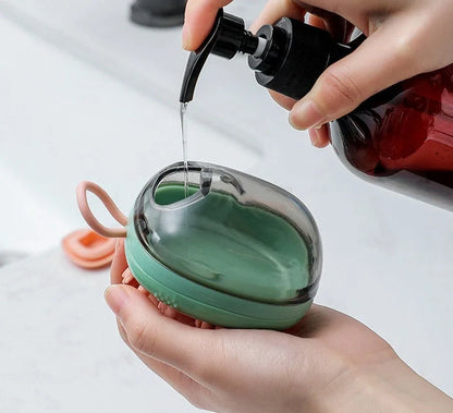 2-in-1 pet cleaning and massage brush with shampoo dispenser in green and blue