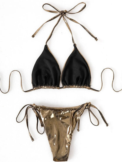 Metallic gold three-piece swimwear set with lace-up bikini top, matching skirt, and shorts