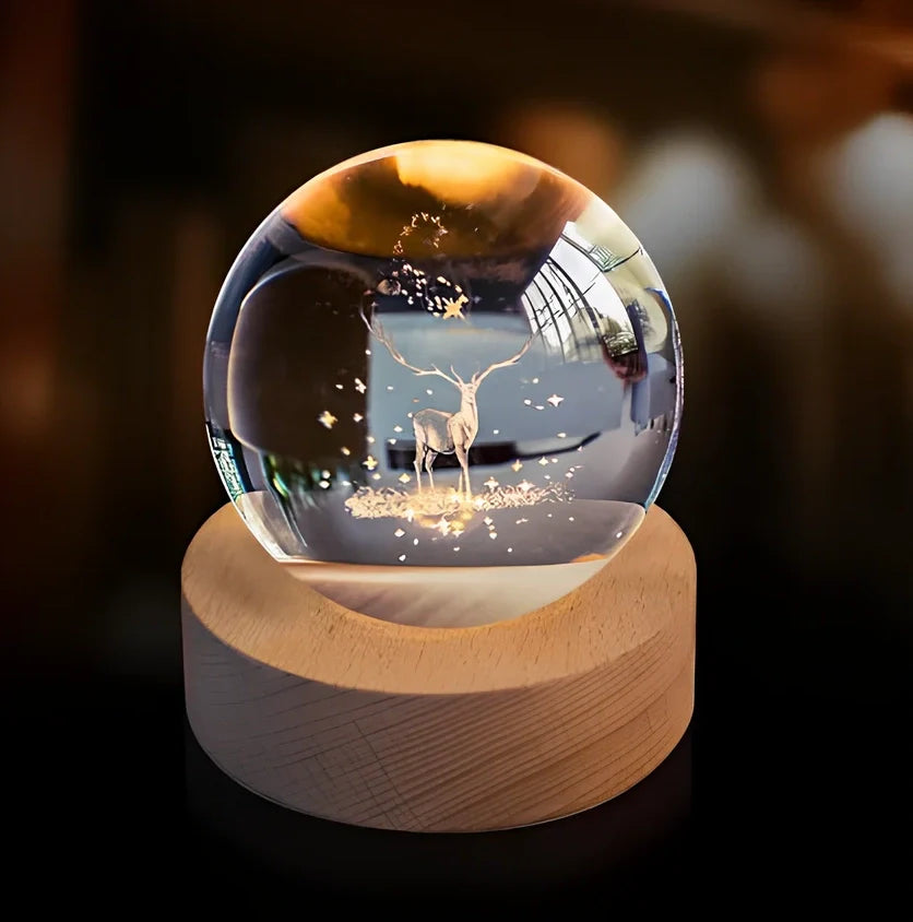3D crystal ball night light projecting solar system pattern on wooden base with astronaut figurine