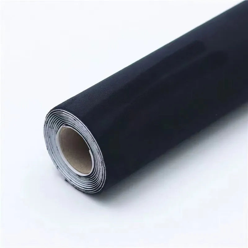 Rolls of self-adhesive leather suede in multiple colours showing texture and adhesive backing.