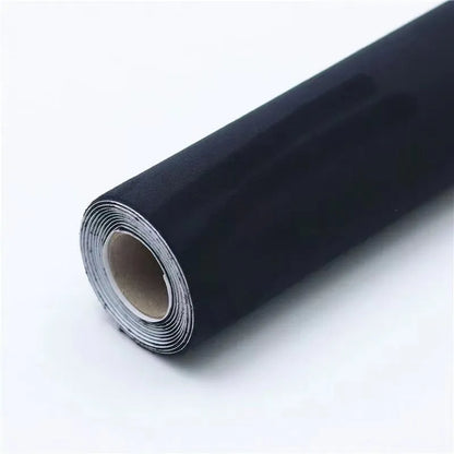 Rolls of self-adhesive leather suede in multiple colours showing texture and adhesive backing.