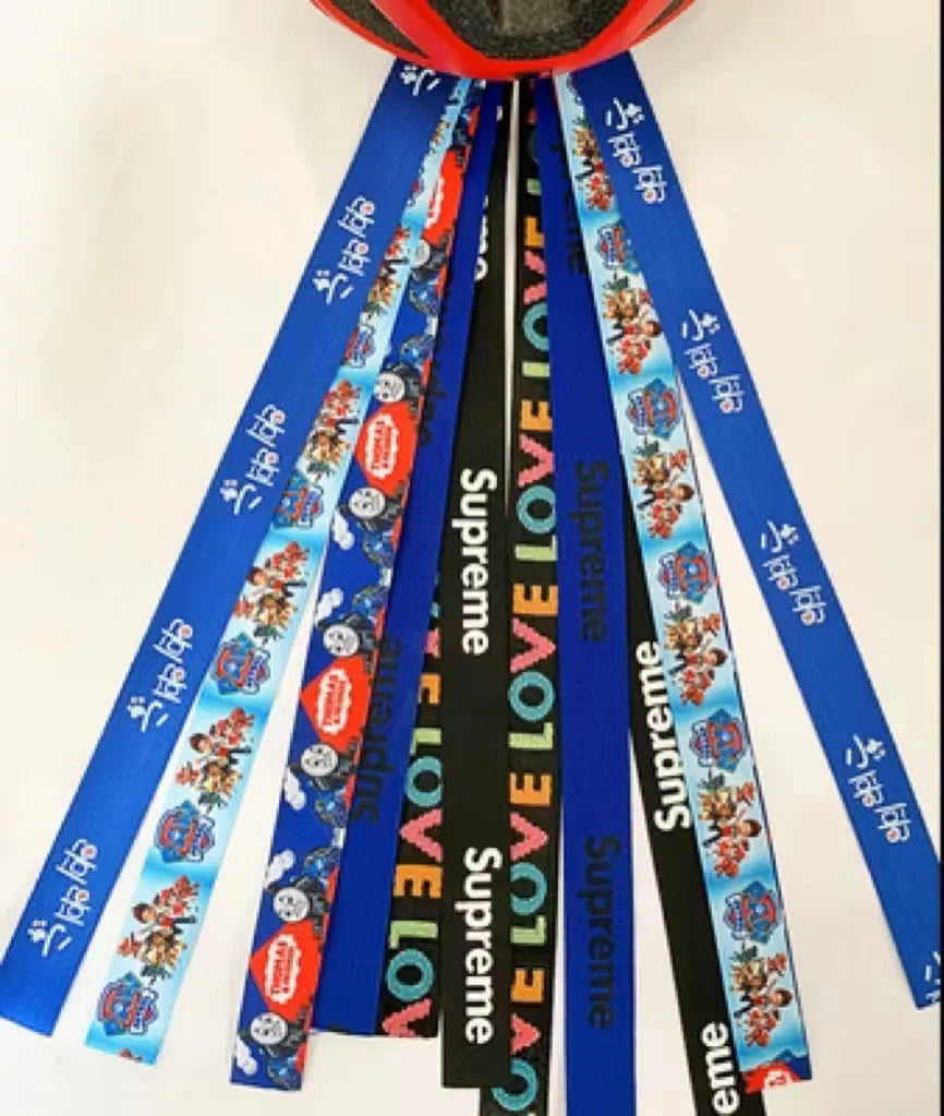 Children's helmet streamer with 60 cm polyester ribbon in colours like apricot and khaki for roller skating and skiing
