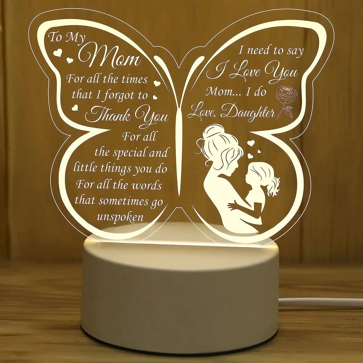 White heart-shaped touch control table lamp on a wooden desk.