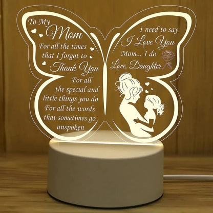White heart-shaped touch control table lamp on a wooden desk.