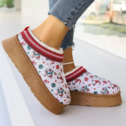Women's winter ankle boots with festive cartoon Christmas print, plush lining, and durable EVA sole for comfortable, warm wear.