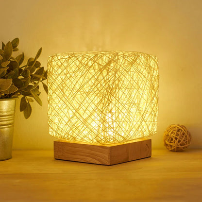 Elegant bamboo rattan desk lamp with dimmable LED lighting and USB charging capabilities