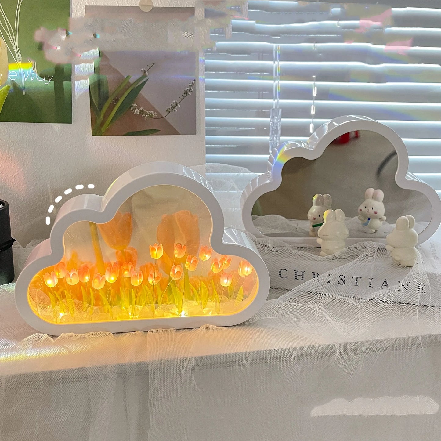 DIY tulip-shaped night lamp kit with LED lights and mirror surface in assorted colours on a desk.