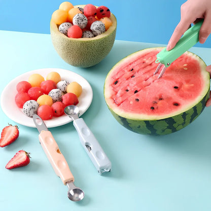 Three-in-one stainless steel watermelon ball digger in grass green, 24cm long with hidden knife and 10cm scoop for fruit slicing