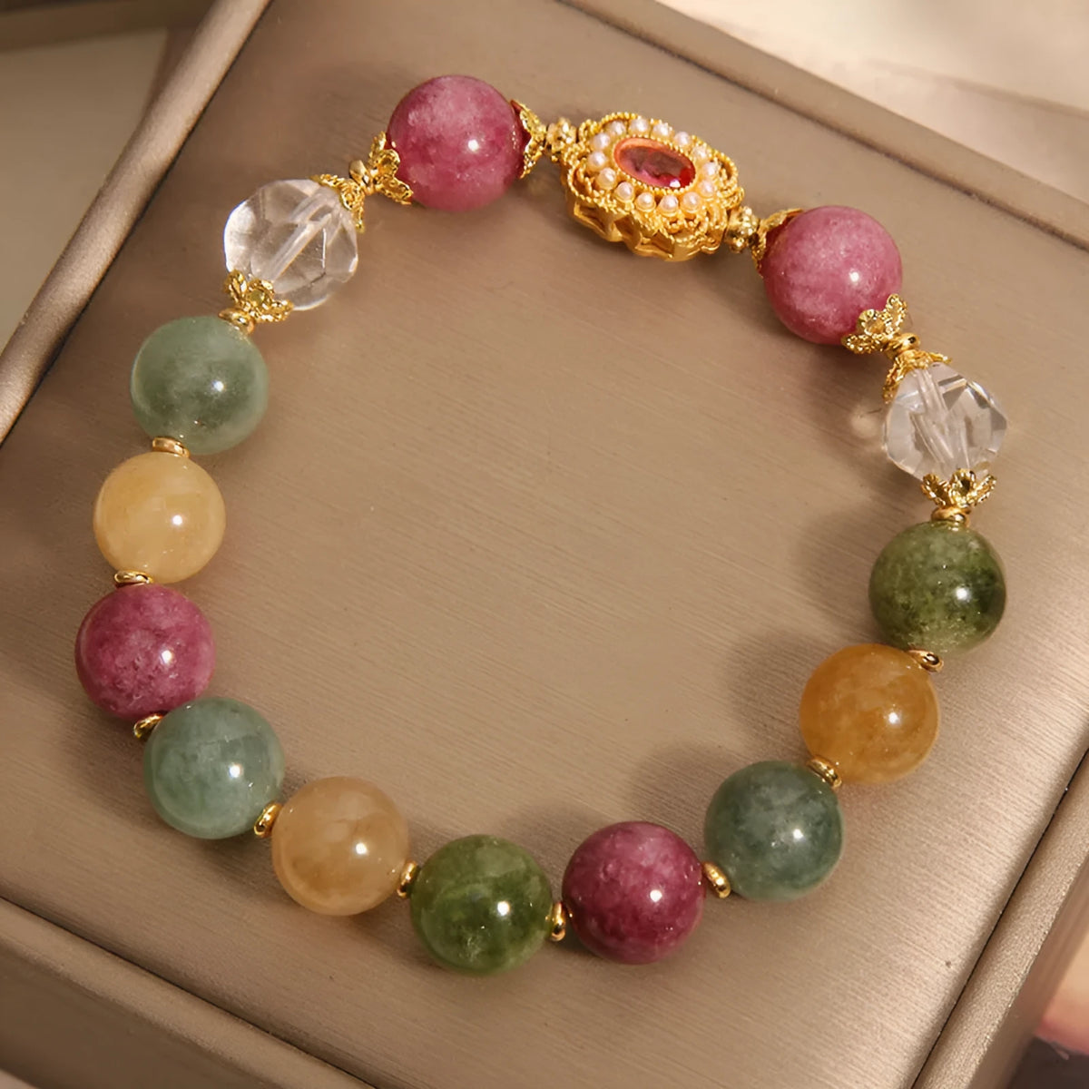 Jade colour tourmaline round bead bracelet for women with alloy inlay and rhinestones on a pearl crystal base.