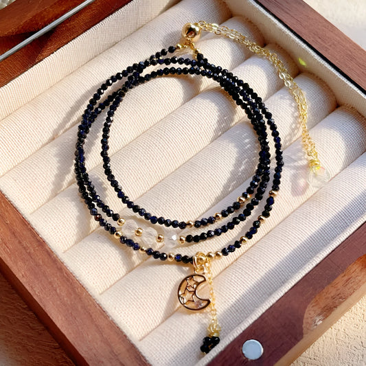 Blue gold sand stone cut three-ring multi-layer bracelet for women on a wrist.