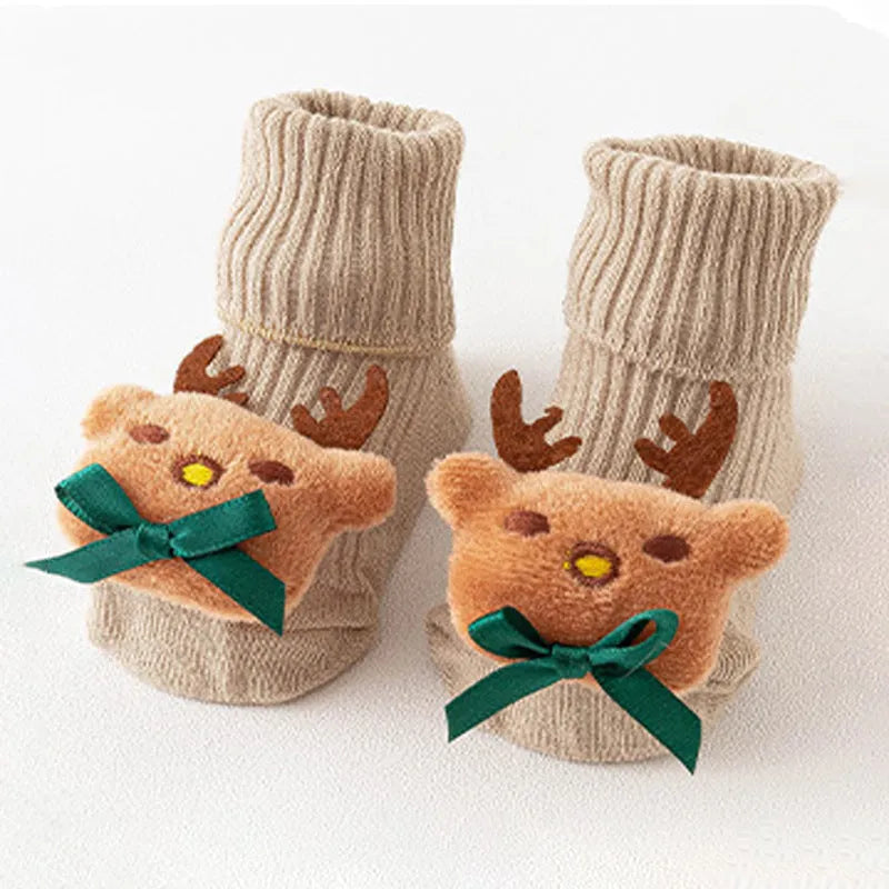 Cotton baby floor socks in assorted colours and patterns including bows, stars, and animal designs.