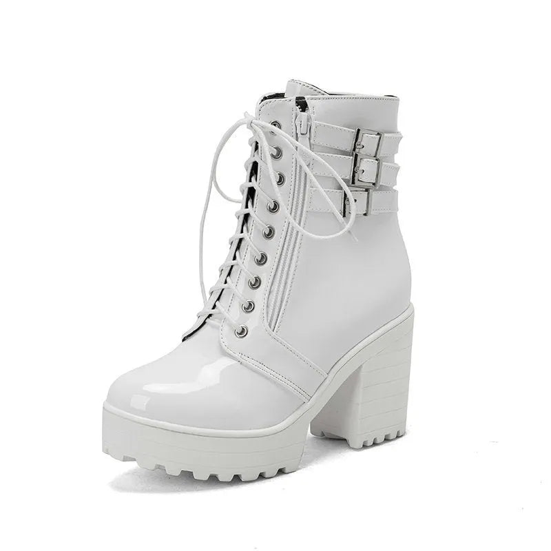 Women's black lace-up ankle boots with a round toe and thick block heel on a waterproof platform sole.
