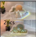 DIY tulip-shaped night lamp kit with LED lights and mirror surface in assorted colours on a desk.