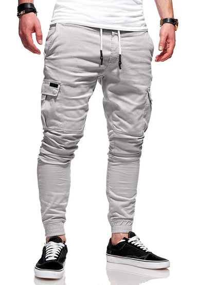 Men's loose-fit casual trousers with elastic waistband and patch pockets in army green colour