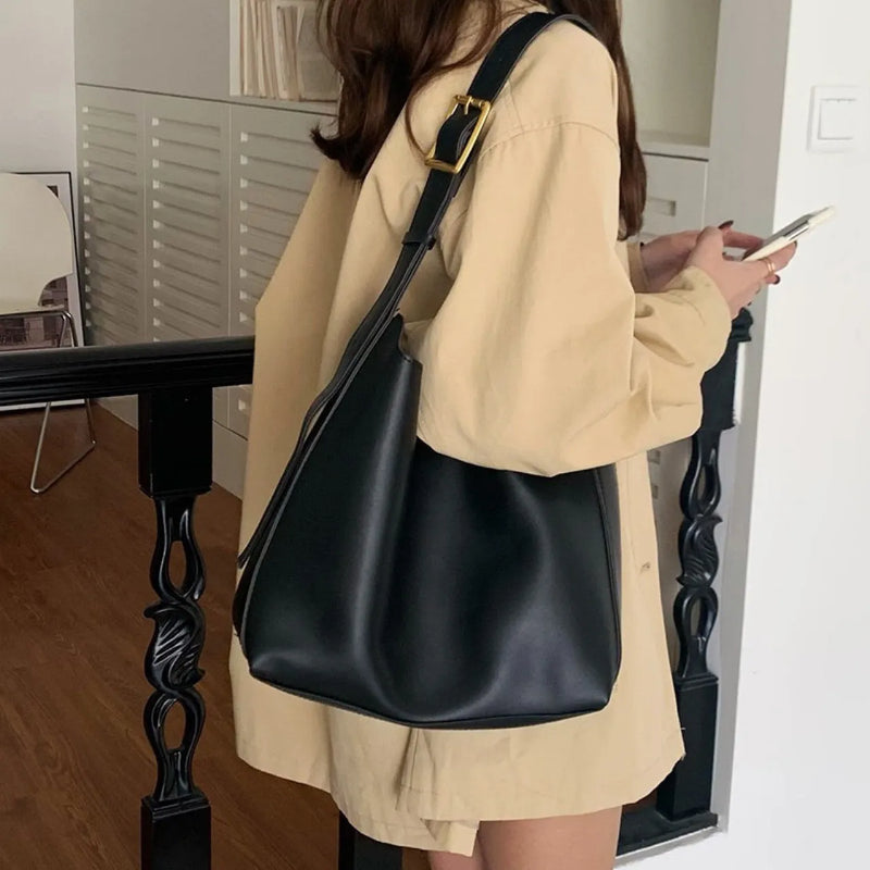 Women's fashion personalised all-match shoulder bag in black or brown with soft PU leather construction, measuring 28cm wide by 32cm tall by 12cm deep, featuring decorative swing threads for versatile casual styling