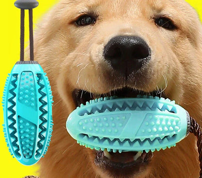 Red and blue silicone dog ball toy with suction cup attached to tile surface
