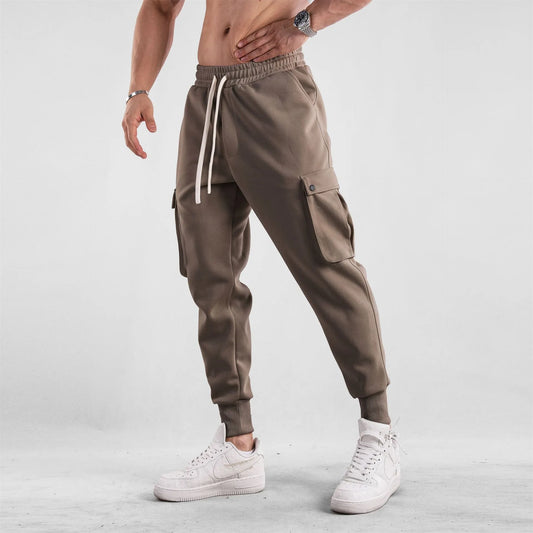 Men's loose-fit cotton sports trousers with ankle ties and multiple pockets in various colours