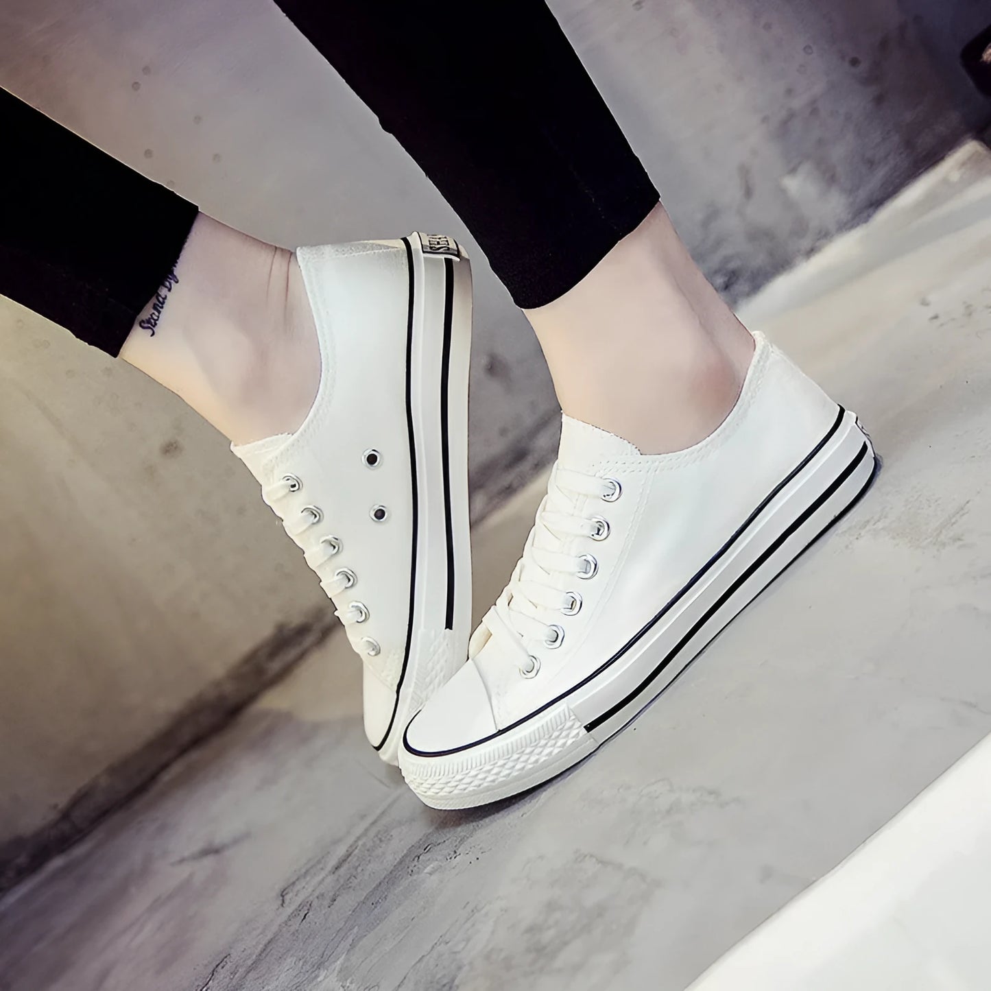 Women's low-top canvas shoes in solid colours on a plain background, showing rubber sole and classic casual style.