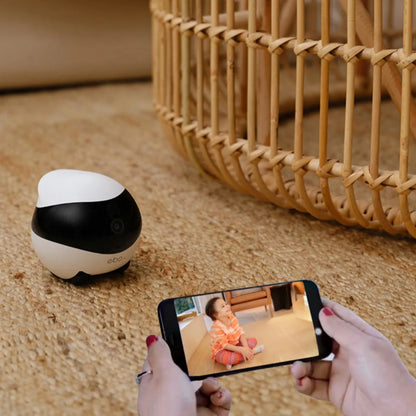 Smart home mobile surveillance robot camera with white colour and compact design for indoor monitoring