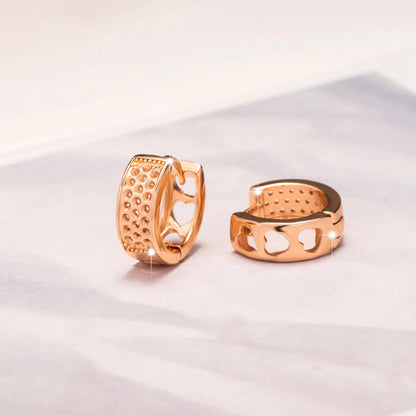 Rose gold electroplated earrings with 2.5cm circular design and three heart-shaped cut-outs