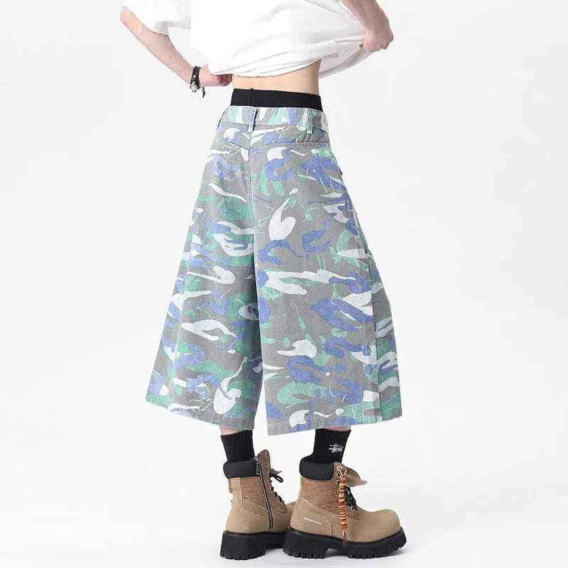 Denim workwear trousers with camouflage colour pattern, straight-leg cut, and zipper fly