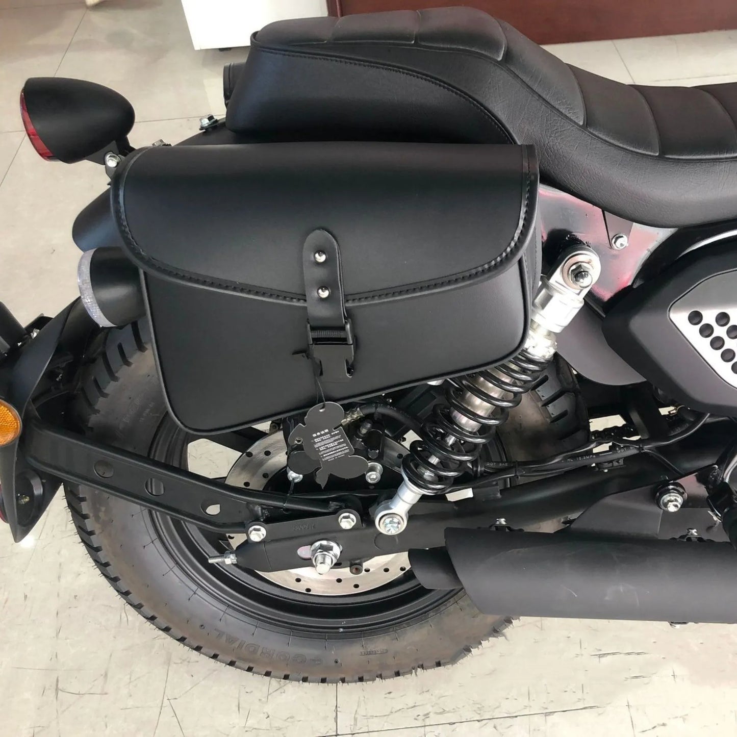 Black PU leather motorcycle swingarm side saddlebag for Harley Sportster with dimensions 30x24x20cm
