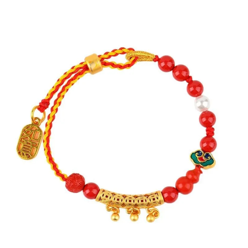 Women's red cinnabar hand-woven rope bracelet with geometric design and bell charm