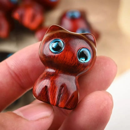 Handmade green sandalwood kitten ornament with unique design