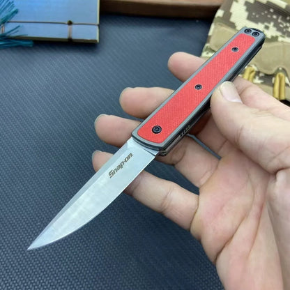 Folding fruit knife with 7cm stainless steel blade shown open and closed, available in black, red, or coffee colour finishes