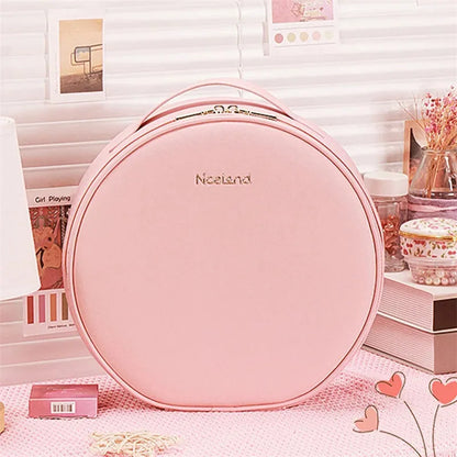 Round black LED light makeup bag with built-in mirror, carry strap, and open compartment showing internal partitions.