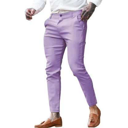 Men's slim fit elastic cotton pencil trousers in a solid colour on a hanger, showing the zip fly and mid waist design.