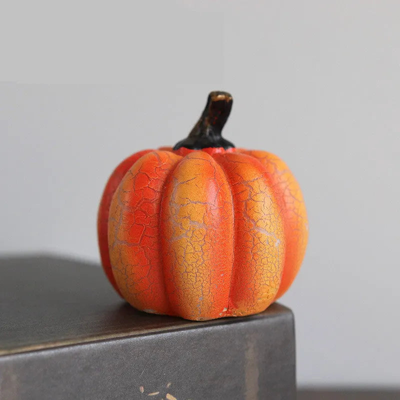 Set of three resin Halloween pumpkin lanterns with LED lights in long, medium, and short sizes.