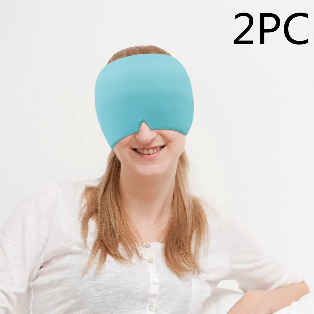 Black elastic gel headache relief mask laid flat showing eye contours and adjustable headband.