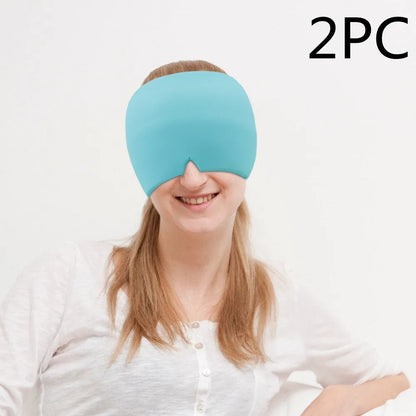 Black elastic gel headache relief mask laid flat showing eye contours and adjustable headband.