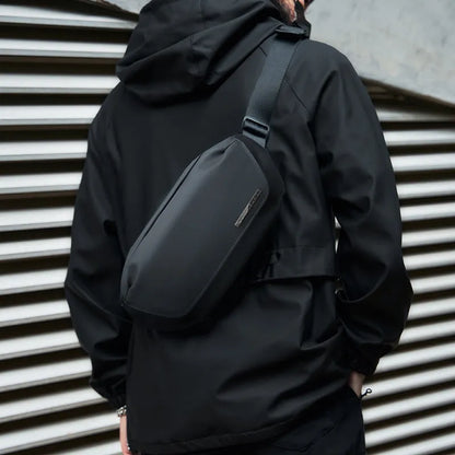 Black men's messenger bag with Oxford cloth exterior and cross-body strap for daily commuting