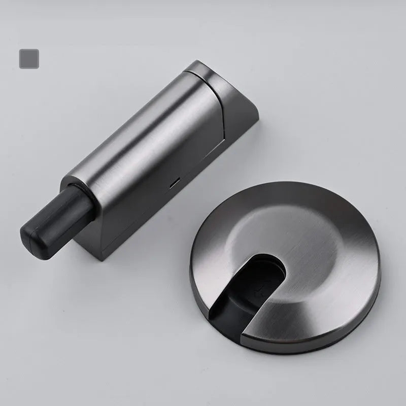 A modern invisible door stopper made from zinc alloy in a brushed gold finish.