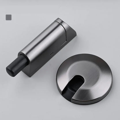A modern invisible door stopper made from zinc alloy in a brushed gold finish.