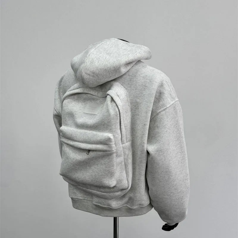 Light grey men's backpack design hooded coat jacket on a hanger.