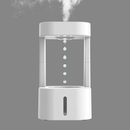 Creative anti-gravity water drop humidifier with upward flowing droplets and coloured lights