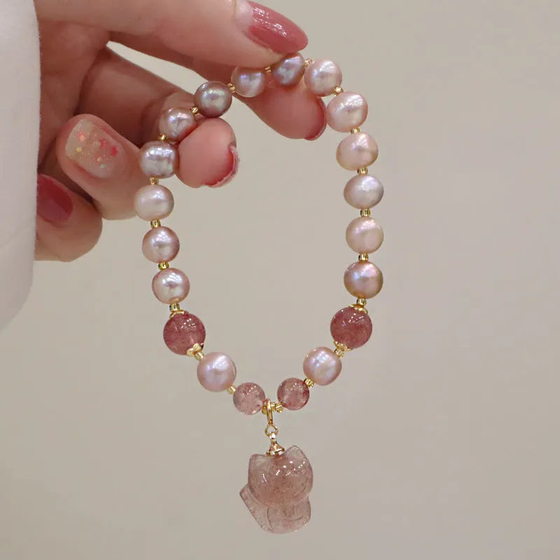 Women's light pink freshwater pearl bracelet with fox charm and zodiac animal design