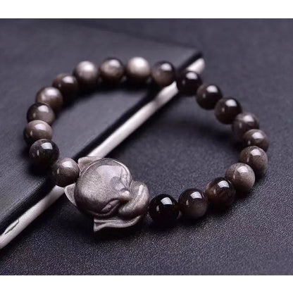 Obsidian fox bracelet with 8mm polished black stone bead and sterling silver fox charm on a bracelet chain.