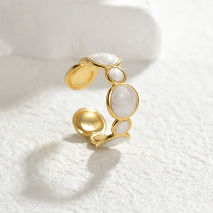 Adjustable geometric stainless steel ring with electroplated finish showing angular design and opening mechanism