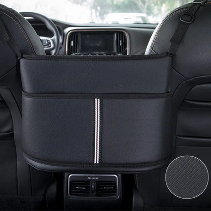 Black leather car seat gap storage bag with carbon fibre pattern, shown between car seats.