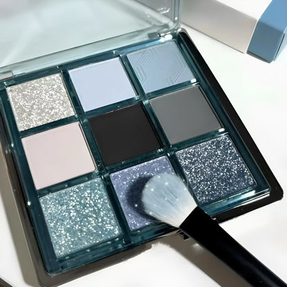 Low saturation blue smoked eye shadow palette with nine colours including matte and shimmer finishes with diamond debris textures