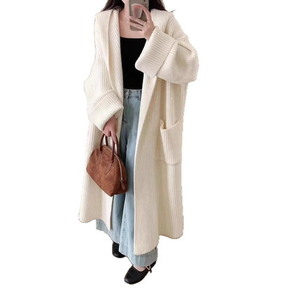 Loose hooded women's cardigan with raglan sleeves in milky white colour showing extended 80cm length