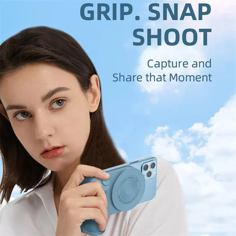 Black magnetic phone camera grip holder with rotatable stand on a table next to a smartphone.