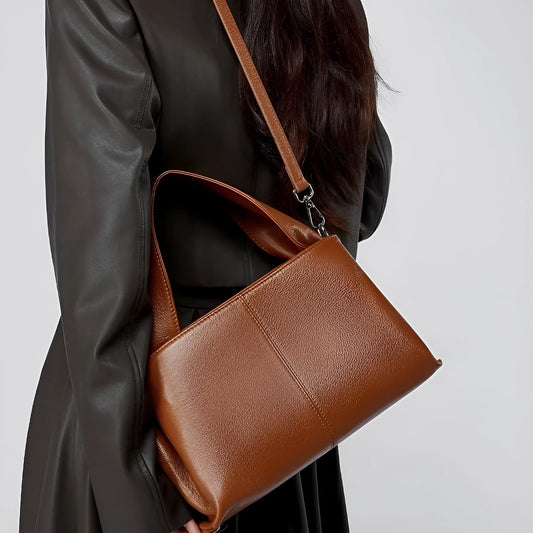 Women's genuine cowhide retro texture messenger bag in horizontal square shape, shown in apricot colour with double shoulder straps.