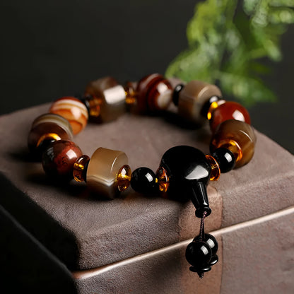 Natural agate ethnic bracelet with geometric design featuring multiple agate bead types and sizes