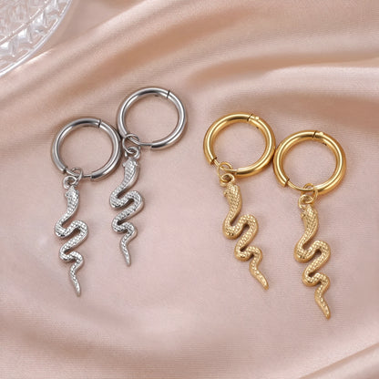 Gold coloured snake-shaped vintage clip-on earrings made from stainless steel.